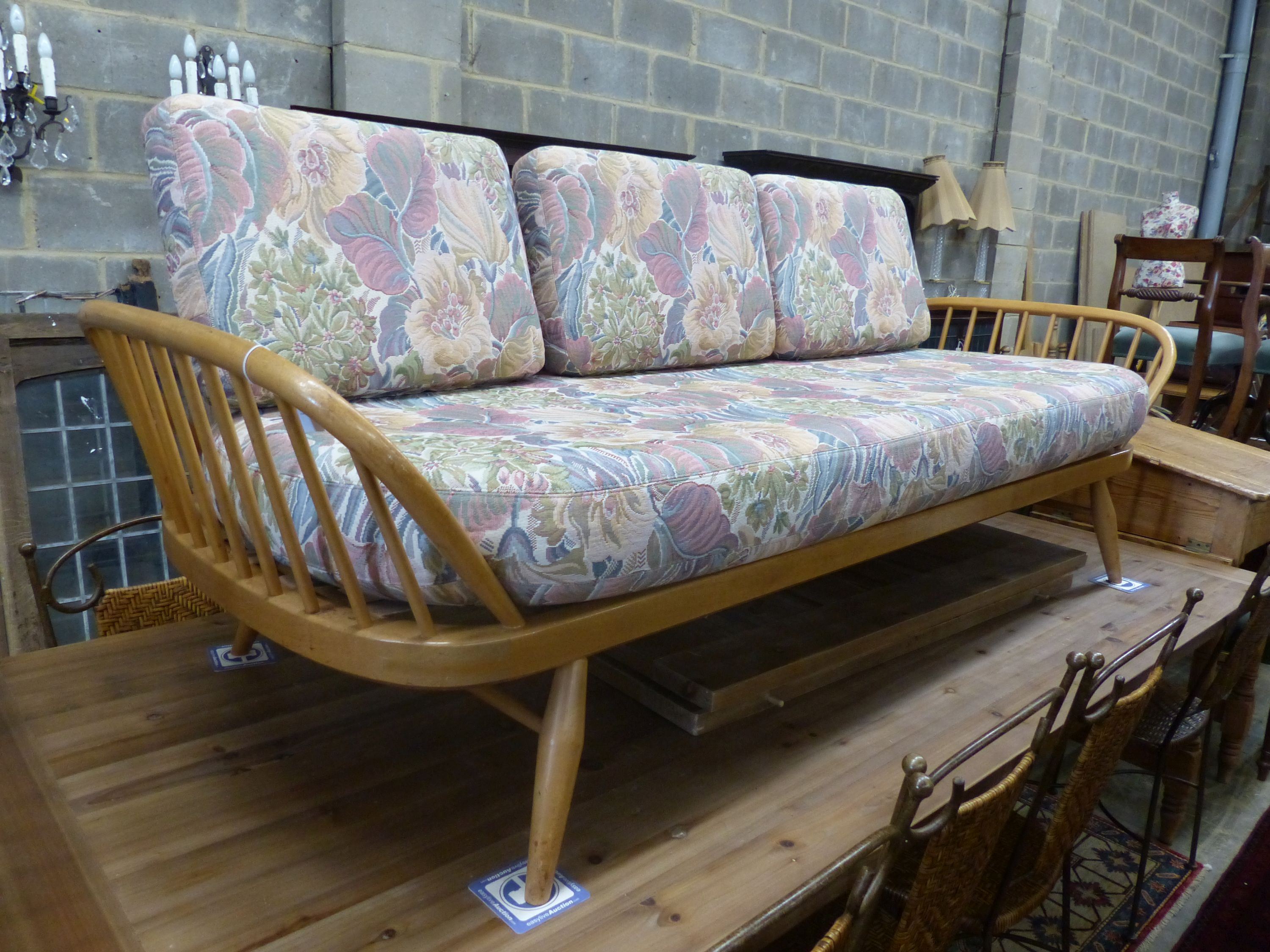 An Ercol light elm and beech settee 'surfboard' settee, length 206cm, depth 75cm, height 72cm